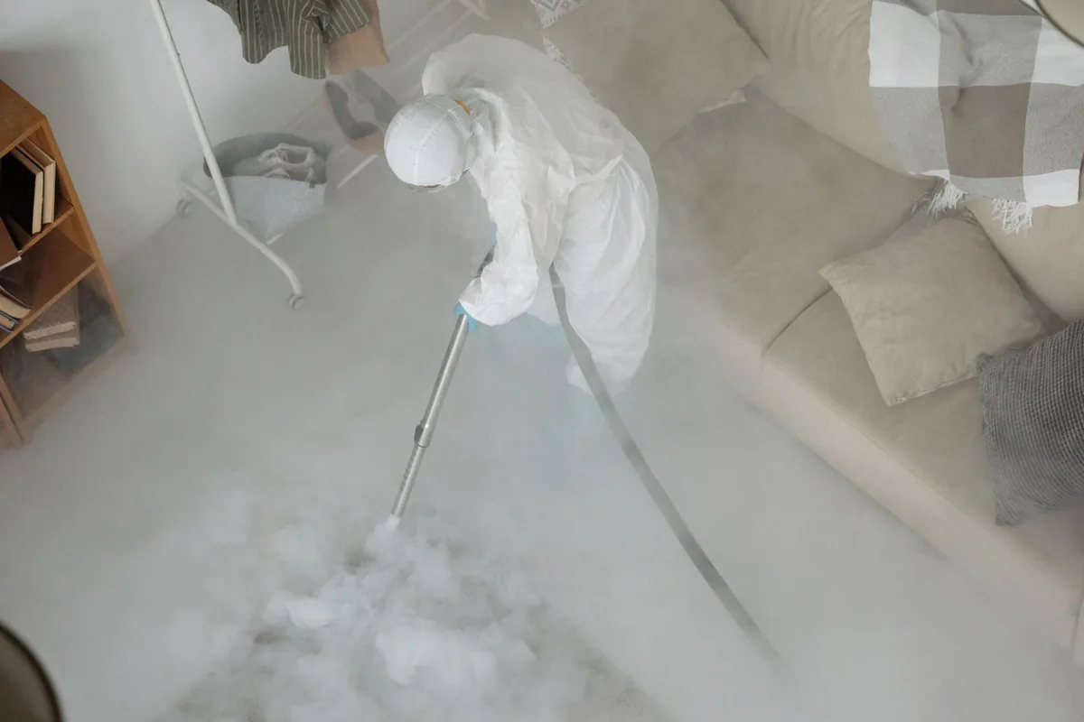 Biohazard cleanup technician in protective equipment, Palmer, AK